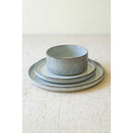 Three dishes from Kalalou's Glacier Ceramic Dinner Collection on a textured surface.