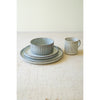 Kalalou's Glacier Ceramic Dinner Collection: Ribbed textured set with bowl, plates & cup on a light surface.