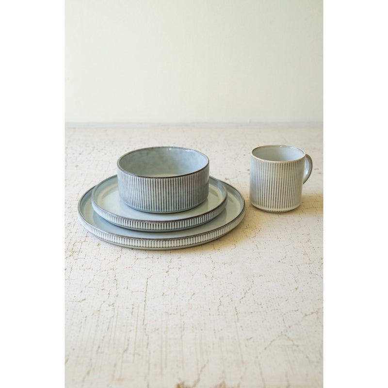 Kalalou's Glacier Ceramic Dinner Collection: Ribbed textured set with bowl, plates & cup on a light surface.