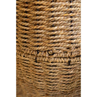 Close-up of a woven natural fiber basket showing the detailed texture of the tan and brown rope material.