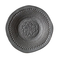 The Chamberlin Ceramic Platter from Handmade Studio features a round, organic design with intricate lace-like patterns in the center, set against a white background. This elegant and textured ceramic plate is the perfect handmade gift.