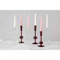 Set of candlesticks with candles on a gray background