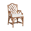 Kenian's Chippendale Arm Dining Chair in a tortoise finish showcases an intricate backrest design and comes with a plush white seat cushion.