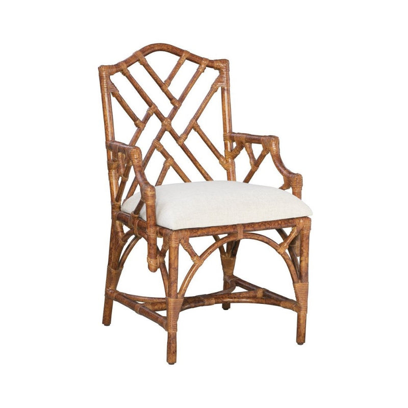Kenian's Chippendale Arm Dining Chair in a tortoise finish showcases an intricate backrest design and comes with a plush white seat cushion.