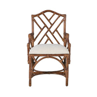 The Chippendale Arm Dining Chair by Kenian features a geometric lattice backrest, a white seat cushion, and a tortoise finish.