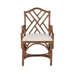 The Chippendale Arm Dining Chair by Kenian features a geometric lattice backrest, a white seat cushion, and a tortoise finish.