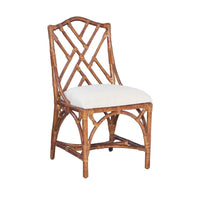 Kenian's Chippendale Side Dining Chair in a tortoise finish boasts a lattice backrest and a white cushioned seat for an elegant touch.