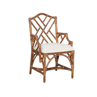 The Kenian Chippendale Tortoise Finish Dining Chair features a geometric back and white cushion for an antique look.
