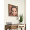 thin wood photo frame hung on wall