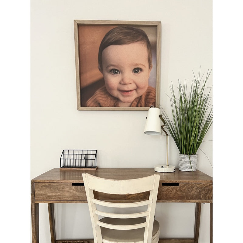 thin oak photo frame on wall