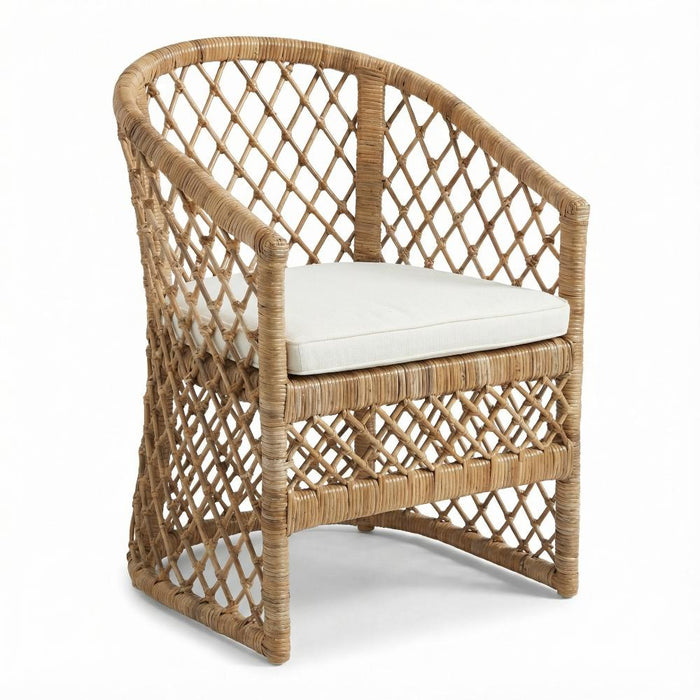 Wicker chair with a white cushion on a white background