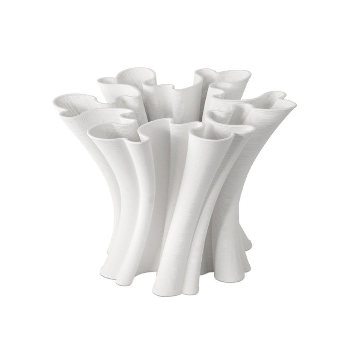 White ceramic vase with a unique, organic design on a white background