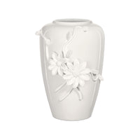 White ceramic vase with floral designs on a white background