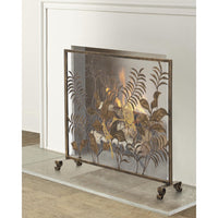 A decorative fireplace screen with an ornate leaf pattern in a bronze finish, standing on small feet in front of a white fireplace opening.
