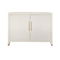 Phillips Scott Delmar White Sand Raffia Cupboard: 2-door, gold handles/accents, shown against a white background.
