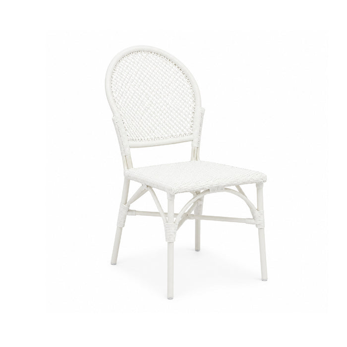 The Donovan White Faux Rattan Indoor/Outdoor Chair by Made Goods features a rounded back and woven seat, perfect for patios.