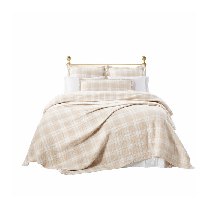 The Doyle Dune Bedding Collection by Orchids Lux Home features beige plaid bedding, matching pillows, and a cotton throw.