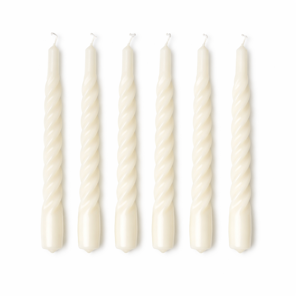 Set of six white twisted candles on a white background