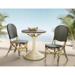 French bistro chair rounded back natural rattan frame black beige woven plastic wrapping Padma's Plantation