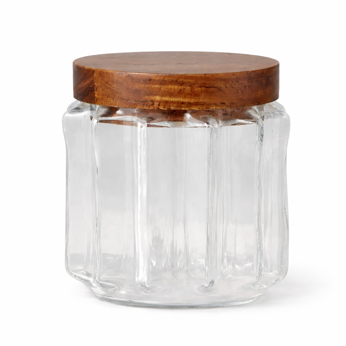 Clear glass jar with a wooden lid on a white background