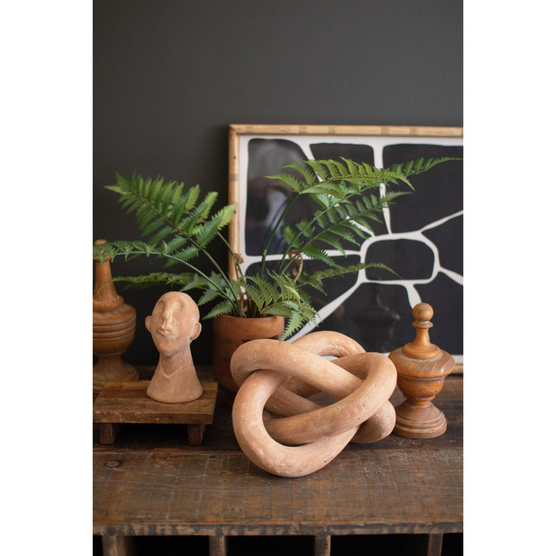 large clay linking loops sculpture