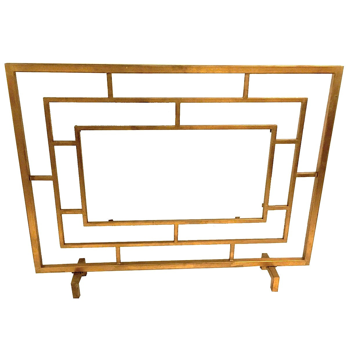 The Dessau Home Center Panel Glass Antique Gold Fireplace Screen is a chic geometric accessory for contemporary fireplaces.