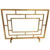 The Dessau Home Center Panel Glass Antique Gold Fireplace Screen is a chic geometric accessory for contemporary fireplaces.