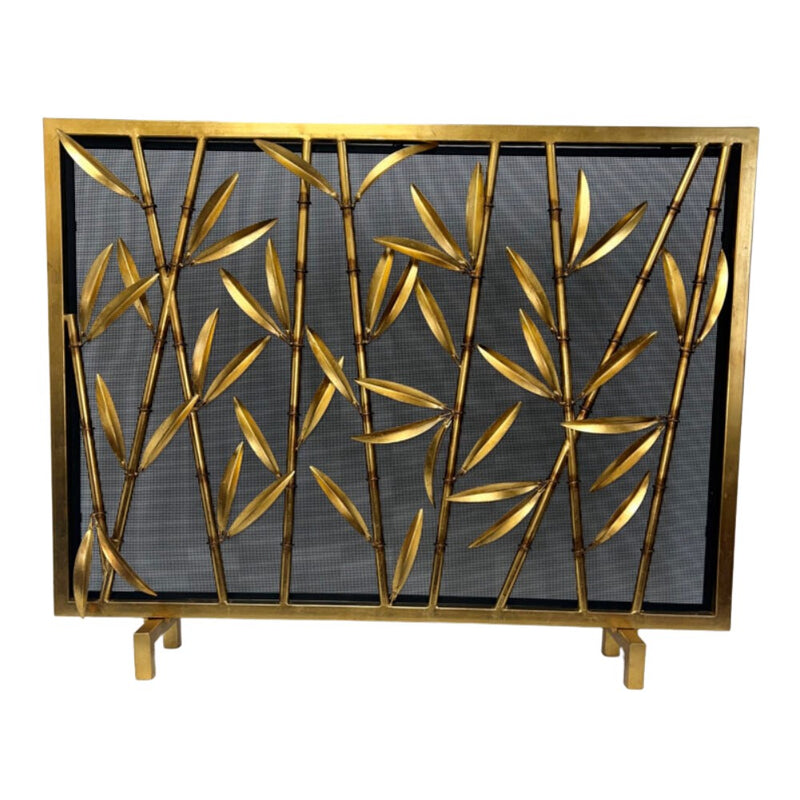 Dessau Home's Antique Gold Bamboo Fireplace Screen features bamboo branches on black mesh.