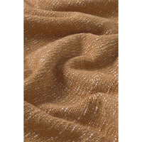 A close-up of draped fabric in a warm camel brown color with a fine white speckled texture.