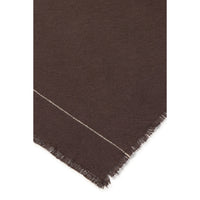 A close-up of a dark brown napkin showing a diagonal white stitched line and fringed edges against a white background.