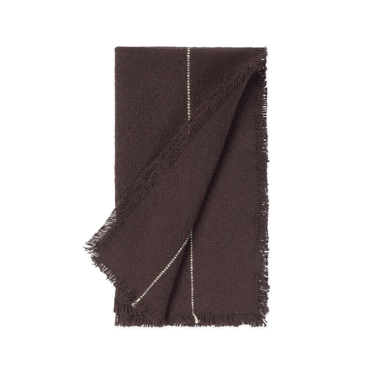A dark brown woven napkin with fringed edges and a thin white stitched detail, folded neatly on a solid white background.