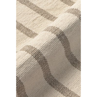 Close-up of a woven placemat with a cream base and taupe-gray stripe pattern.
