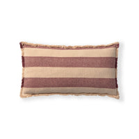 A rectangular woven throw pillow with horizontal stripes in beige and dusty rose, finished with a fringed edge, shown on a plain white background.