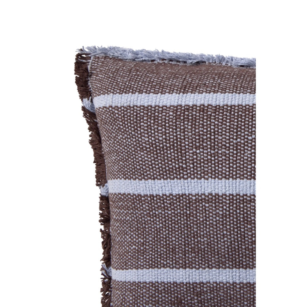 A close-up of a woven throw pillow corner showing a textured brown and white striped pattern with fringed edges, isolated on a white background.