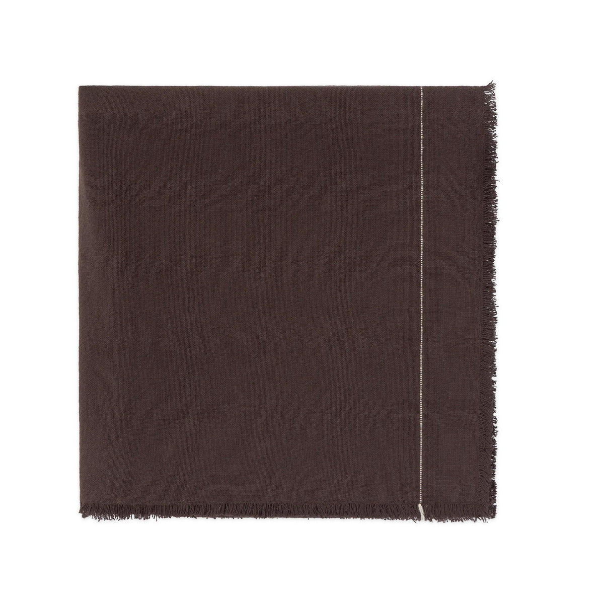 A dark brown woven tablecloth showing a fringed edge and a thin light-colored stitched detail