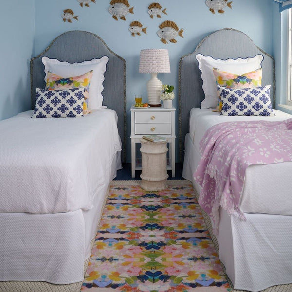 The Color Me Happy Floor Mat by Laura Park Designs adds vibrant color and warmth to this cozy bedroom.
