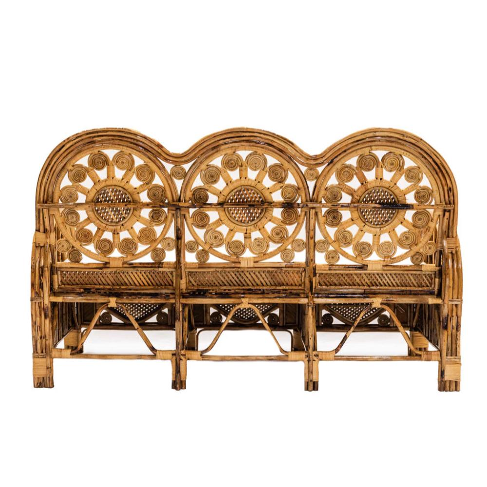Wicker bench with decorative backrest on a white background