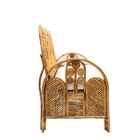 Wicker sofa side view with decorative design on a white background