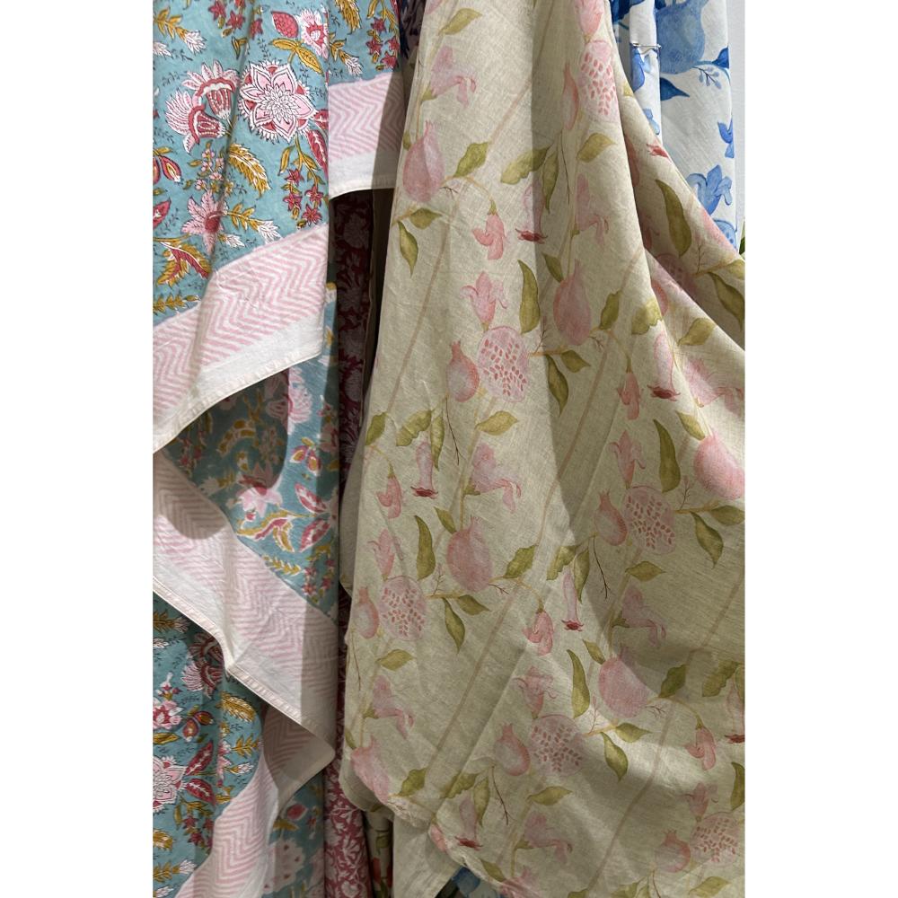 Close-up of Abigails Pink Pomegranate Cabana Napkins (set of 8) in pink, blue & green floral patterns.