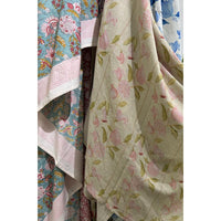Close-up of Abigails Pink Pomegranate Cabana Napkins (set of 8) in pink, blue & green floral patterns.
