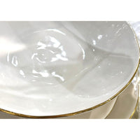 Close-up of Abigails Gold Rim Soup Bowls (set of 2), featuring elegant white ceramic with gold rims.