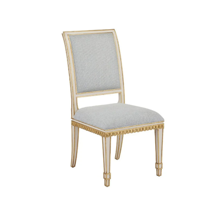The Currey & Company Ines Moonstone Ivory Chair features a light wood frame and moonstone fabric on a white background.