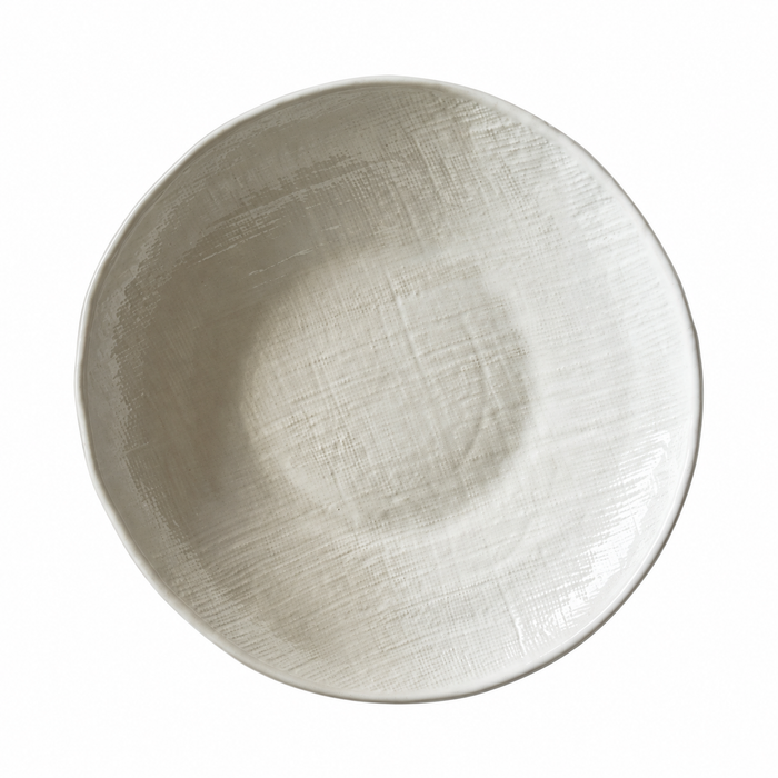 A round ceramic plate with a textured, hand-painted finish in a warm off-white or light beige color, shown from a top-down perspective on a solid white background.