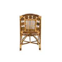 Wicker chair with decorative backrest on a white background