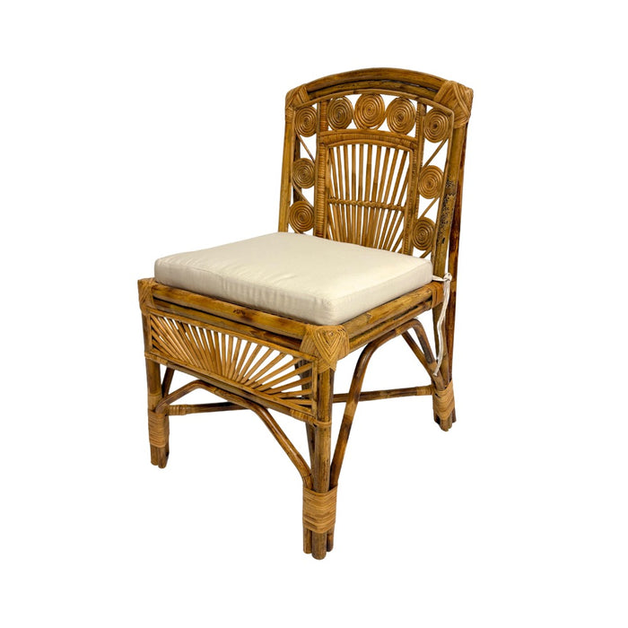 Wicker chair with a white cushion on a white background