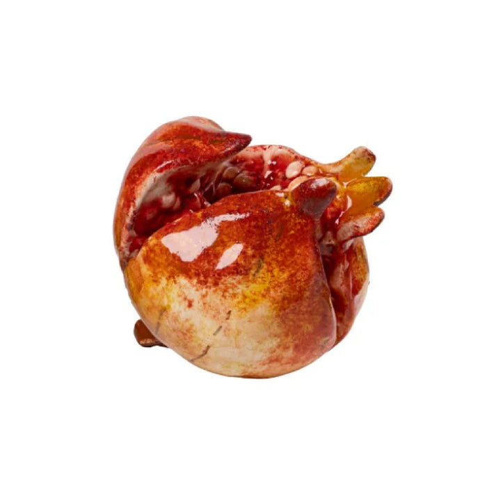 a ceramic figurine of a pomegranate 