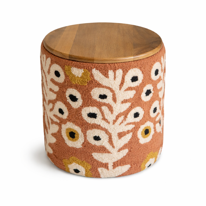 Wooden stool with a floral patterned cushion on a white background