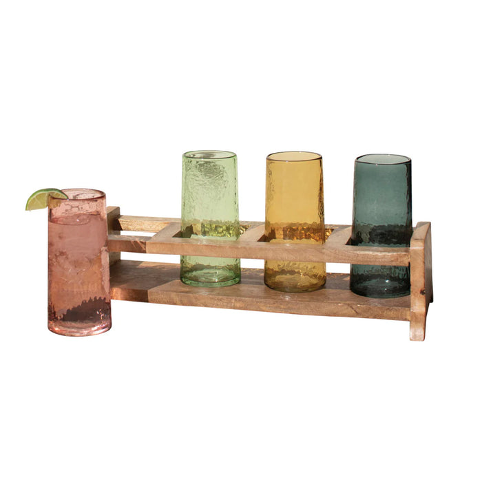 Wooden drink holder with four colored glasses on a white background