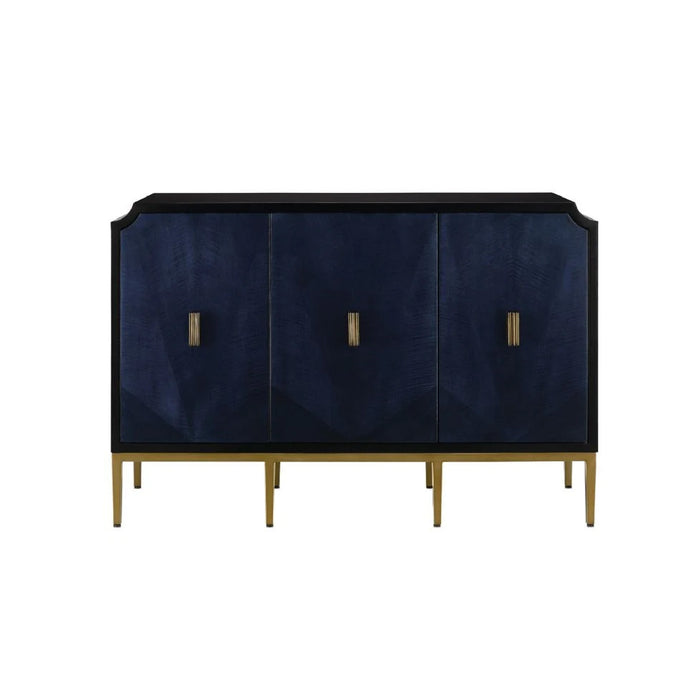 The Currey & Company Kallista Sapphire Blue Cabinet features three doors, gold handles, and hidden storage.