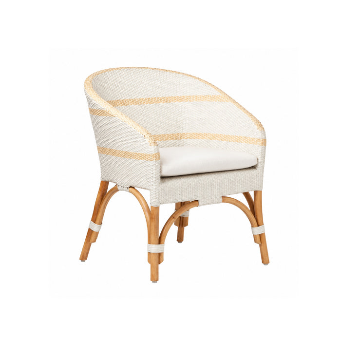 The Made Goods Keanu Rattan White Dining Chair features a curved rattan back, wood legs, and a performance fabric cushion.